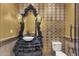 Stylish powder room with a dark vanity, vessel sink, and designer mirror at 15536 E Heavenly Vista Trl, Fountain Hills, AZ 85268
