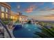 Beautiful infinity pool with integrated spa and panoramic views of the surrounding landscape and city at 15536 E Heavenly Vista Trl, Fountain Hills, AZ 85268