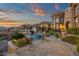 Resort-style pool area with lush landscaping, a waterfall feature, and stunning views at 15536 E Heavenly Vista Trl, Fountain Hills, AZ 85268