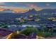 Twilight view of the serene community, desert landscape, and mountains beyond at 15536 E Heavenly Vista Trl, Fountain Hills, AZ 85268