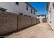 View of the new home's backyard, featuring block walls and stucco walls at 15593 S 180Th Ln, Goodyear, AZ 85338