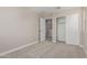 Bedroom featuring a closet with sliding doors and access to another room at 15593 S 180Th Ln, Goodyear, AZ 85338