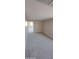 Neutral bedroom with plush carpet and an open doorway, offering a serene and comfortable space at 15593 S 180Th Ln, Goodyear, AZ 85338