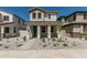 Attractive two-story house featuring a inviting front porch, low maintenance desert landscaping at 15593 S 180Th Ln, Goodyear, AZ 85338