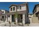 Inviting two-story home featuring a charming facade and desert landscaping in the front yard at 15593 S 180Th Ln, Goodyear, AZ 85338