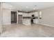 Open-concept kitchen features sleek appliances and an island, perfect for entertaining at 15593 S 180Th Ln, Goodyear, AZ 85338