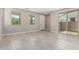 Bright living area features tile flooring, natural light and backyard access at 15593 S 180Th Ln, Goodyear, AZ 85338