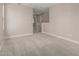 Spacious loft area with beige carpeting and neutral paint, leading to upstairs bedrooms at 15593 S 180Th Ln, Goodyear, AZ 85338