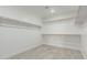 Spacious walk-in closet with multiple shelves and rods for ample storage at 15593 S 180Th Ln, Goodyear, AZ 85338