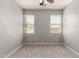 Carpeted bedroom featuring dual windows for natural light at 157 N 110Th Ave, Avondale, AZ 85323