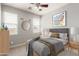 Serene bedroom with neutral tones, natural light, and contemporary furnishings for relaxation at 157 N 110Th Ave, Avondale, AZ 85323