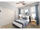 Cozy bedroom with soft lighting, plush bedding, and a spacious closet for storage at 157 N 110Th Ave, Avondale, AZ 85323