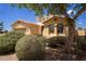 Charming single-Gathering home featuring desert landscaping, a two-car garage and a stucco exterior with a tile roof at 157 N 110Th Ave, Avondale, AZ 85323