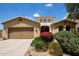 Charming single-Gathering home featuring desert landscaping, a two-car garage and a stucco exterior with a tile roof at 157 N 110Th Ave, Avondale, AZ 85323