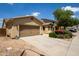 Charming single-Gathering home featuring desert landscaping, a two-car garage and a stucco exterior with a tile roof at 157 N 110Th Ave, Avondale, AZ 85323