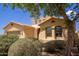 Charming single-Gathering home featuring desert landscaping, a two-car garage and a stucco exterior with a tile roof at 157 N 110Th Ave, Avondale, AZ 85323