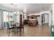 Bright kitchen and dining area featuring stainless appliances, granite countertops, and adjacent dining table at 157 N 110Th Ave, Avondale, AZ 85323