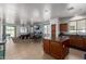 Spacious open floorplan with kitchen, pool table, and eat-in table, offering versatile living and entertaining options at 157 N 110Th Ave, Avondale, AZ 85323