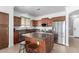 Well-equipped kitchen with stainless steel appliances, granite countertops, and a convenient center island with seating at 157 N 110Th Ave, Avondale, AZ 85323