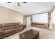 Spacious living room with comfortable seating, large projection screen, and custom cabinetry for entertainment at 157 N 110Th Ave, Avondale, AZ 85323