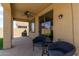 Covered patio area with ceiling fan and tiled flooring perfect for outdoor entertaining at 157 N 110Th Ave, Avondale, AZ 85323