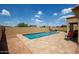 Gorgeous in-ground pool is surrounded by a patio and lush landscaping, creating a private oasis at 157 N 110Th Ave, Avondale, AZ 85323