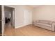 Cozy bedroom featuring neutral walls, a sofa and sliding door closet at 16066 W Sandia Park Dr, Surprise, AZ 85374