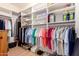 Walk-in closet with built-in shelving and hanging racks, perfect for organization at 16066 W Sandia Park Dr, Surprise, AZ 85374