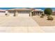 Charming single-story home showcasing a well-maintained front yard and three-car garage at 16066 W Sandia Park Dr, Surprise, AZ 85374