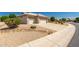 A lovely home with a well-kept front yard and a spacious driveway leading to a three-car garage at 16066 W Sandia Park Dr, Surprise, AZ 85374