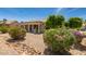 Charming front yard with well-maintained desert landscaping and a view of the house at 16066 W Sandia Park Dr, Surprise, AZ 85374