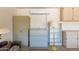 Organized garage equipped with shelving, filing cabinets, and a mini-split A/C unit at 16066 W Sandia Park Dr, Surprise, AZ 85374