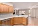 Kitchen features updated stainless steel appliances and view of living area and backyard at 16066 W Sandia Park Dr, Surprise, AZ 85374