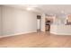 Spacious living room leading to the kitchen, enhanced with modern flooring and ample natural light at 16066 W Sandia Park Dr, Surprise, AZ 85374