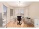 Bright home office featuring natural light, a ceiling fan, and space for productivity at 16066 W Sandia Park Dr, Surprise, AZ 85374