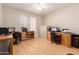 Spacious office featuring desks for two, a ceiling fan and good natural light at 16066 W Sandia Park Dr, Surprise, AZ 85374