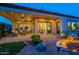 Beautiful backyard featuring a covered patio, fire pit, and outdoor dining and lounge areas at 1617 E Copper Holw, Queen Creek, AZ 85140