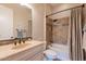 Bathroom featuring tile accents, a shower-tub combo, and neutral walls at 1617 E Copper Holw, Queen Creek, AZ 85140