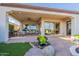Comfortable covered patio with ceiling fan, decorative rock gardens and views of the desert at 1617 E Copper Holw, Queen Creek, AZ 85140