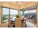 Well-lit dining room with a round table, chairs, and a view of the outdoors at 1617 E Copper Holw, Queen Creek, AZ 85140