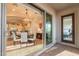 Elegant dining area with modern chandelier and backyard access, perfect for entertaining guests and enjoying Gathering meals at 1617 E Copper Holw, Queen Creek, AZ 85140