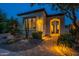 Charming home exterior with stone pathway, desert landscaping and inviting entryway at 1617 E Copper Holw, Queen Creek, AZ 85140