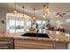 Bright and open kitchen with views to the living room and dining area at 1617 E Copper Holw, Queen Creek, AZ 85140