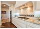Modern kitchen with granite countertops, tile backsplash, and stainless steel appliances at 1617 E Copper Holw, Queen Creek, AZ 85140