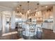 Open-concept kitchen with an island, stainless steel appliances, and a breakfast bar with seating at 1617 E Copper Holw, Queen Creek, AZ 85140