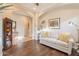 Open living room with wood floors, neutral decor, and a bright, airy feel at 1617 E Copper Holw, Queen Creek, AZ 85140