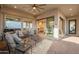 Spacious outdoor patio featuring comfortable seating, showcasing backyard views and a seamless indoor-outdoor living experience at 1617 E Copper Holw, Queen Creek, AZ 85140