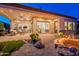 Elegant patio with a fire pit, comfortable seating, and seamless indoor-outdoor flow for stylish entertaining and relaxation at 1617 E Copper Holw, Queen Creek, AZ 85140