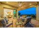 Relaxing patio with comfortable seating, fire pit and beautiful twilight views at 1617 E Copper Holw, Queen Creek, AZ 85140