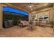 Spacious covered patio with an outdoor kitchen and plenty of room for entertaining at 1617 E Copper Holw, Queen Creek, AZ 85140